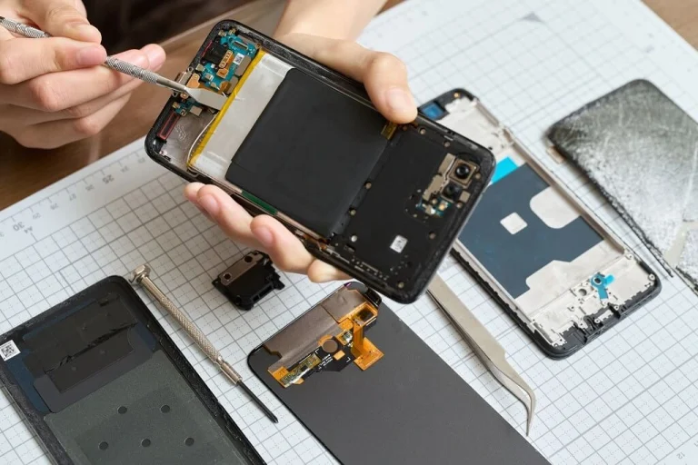 Technician repairing Xiaomi phone in Singapore using professional mobile repair tools and equipment
