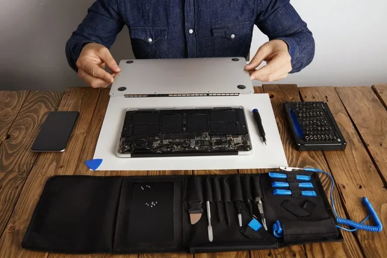 Apple Laptop Repair on Wooden Table with Tools
